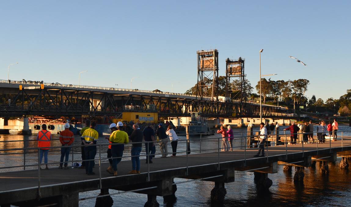 A crowd gathered on the T-Wharf to see the bridge removal begin. Photo: Maeve Bannister