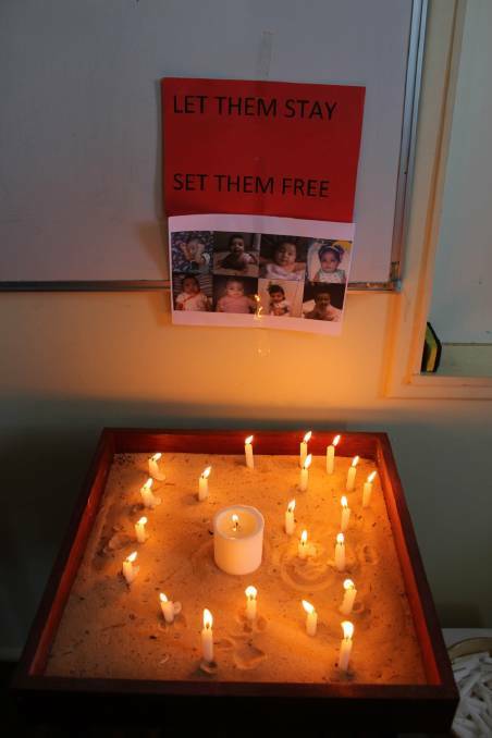Candles at St John's hall, Moruya, were lit in February on behalf of refugees. A lobby group  will hold a meeting there on Thursday, May 26 to seek clarification on Gilmore candidates' refugee policies.