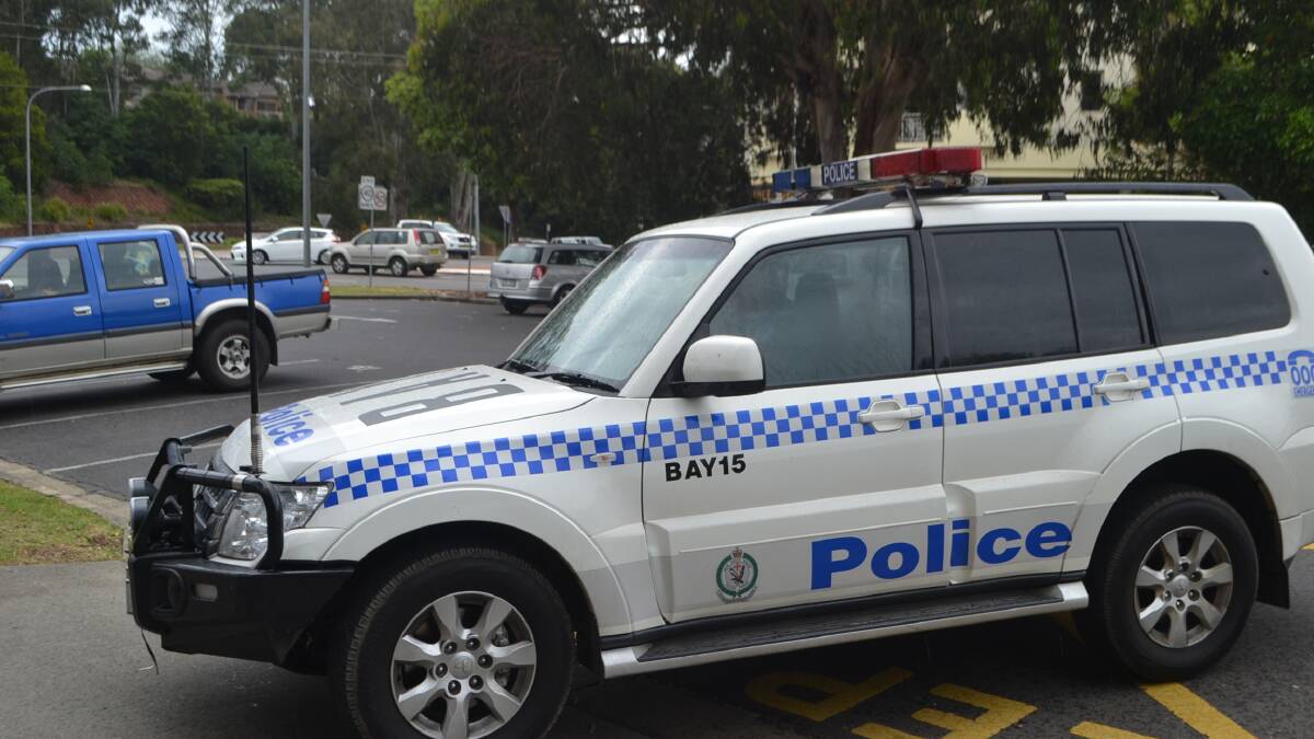 A prisoner is brought to Batemans Bay Police Station on Tuesday, December 14, after being arrested after allegedly stealing a yacht and taking four children to North Durras overnight. He has been charged with theft of a vessel.