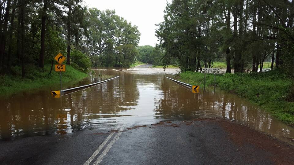 Don't risk it: Police have warned drivers not risk crossing swollen creeks and rivers. A vehicle became stuck in a creek near Dignams Creek on Monday, Janury 4. This is a picture taken at Kiora, near Moruya, on Monday, January 4.