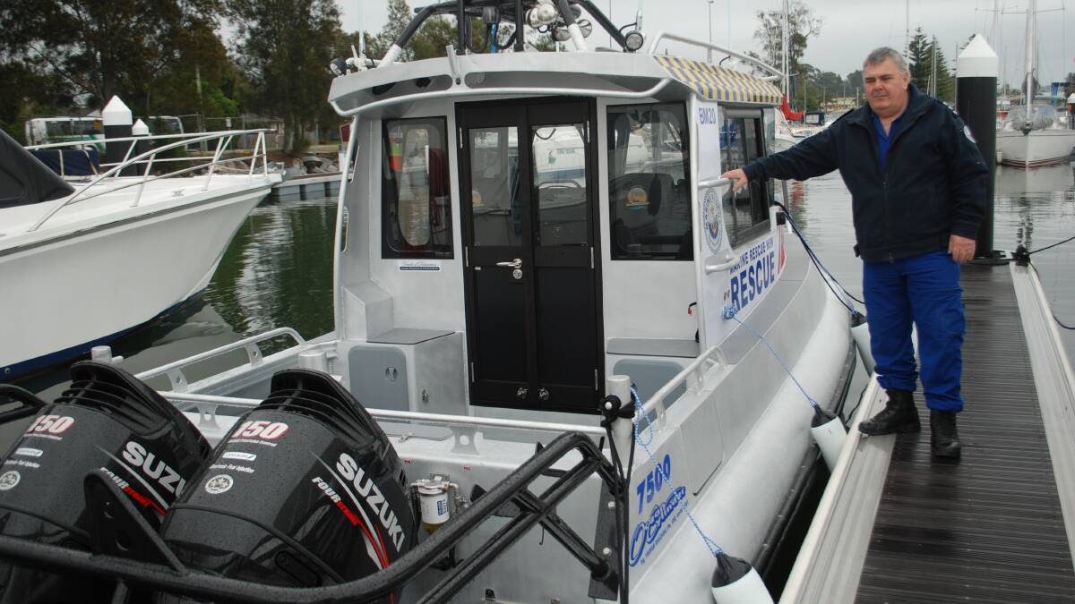 NEW BOAT: Batemans Bay Marine Rescue unit commander Michael Syrek with the BM 20 vessel used in Sunday's tow.