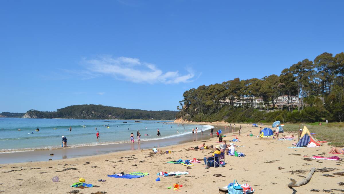SUNNY DISPOSITION: Weather such as this at Denhams Beach on Saturday attracted big numbers of tourists to the Eurobodalla over the long weekend. 