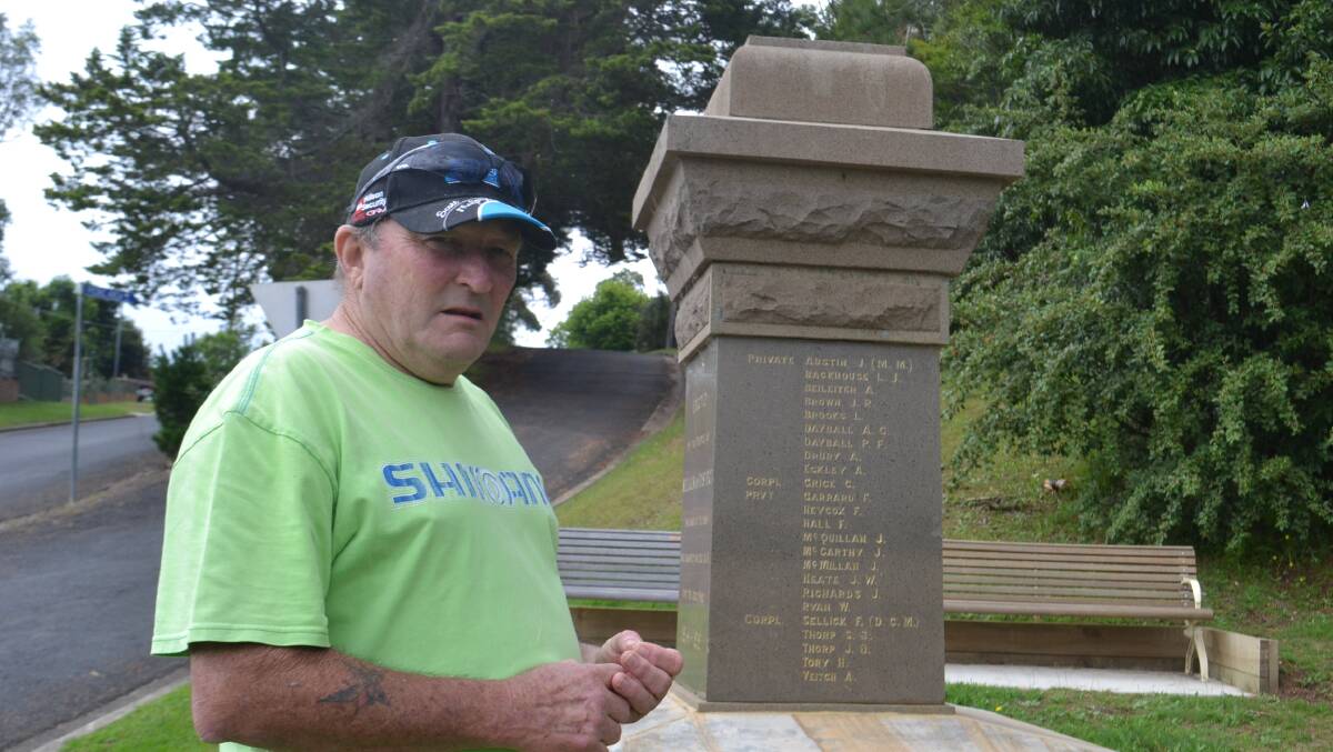 ANGRY COMMUNITY: Nelligen Progress Associationmember Paul Blanch at the damaged cenotaph.