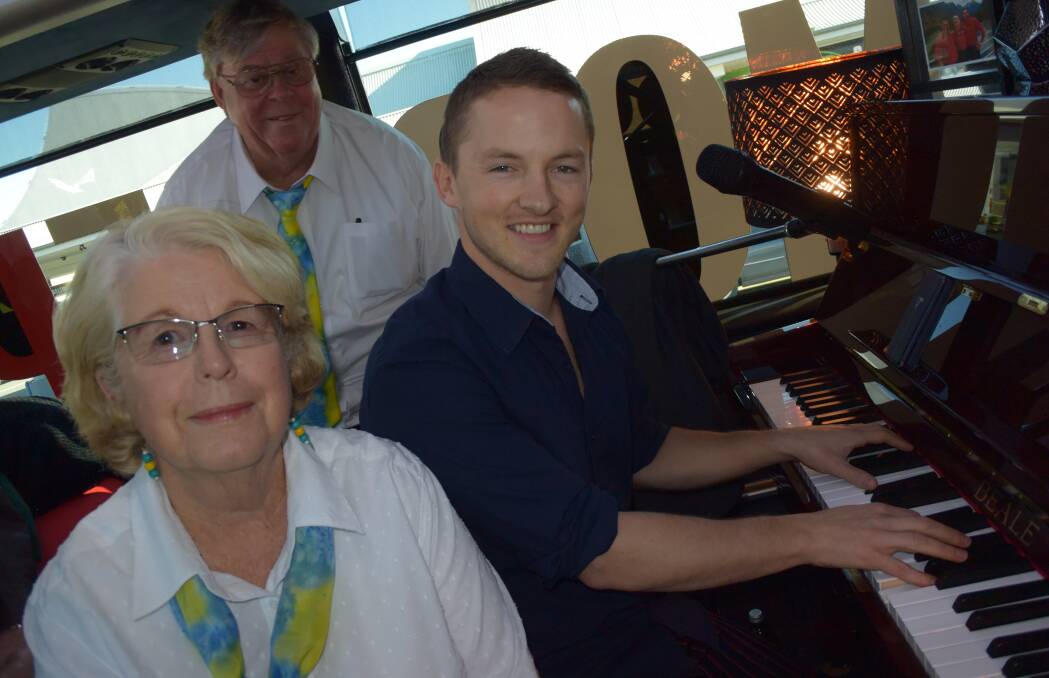 TRAVELLING TUNES: Batemans Bay U3A Singers musical director Lyn Brown and Duro Banjanac join pianist Ash Morse at the Mobile Piano Bar in Batemans Bay on Thursday. 