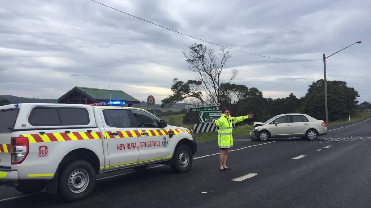 Emergency crews direct traffic at the scene of the two-vehicle accident at the Tuross turn off, Princes Highway on Tuesday, December 8. PIcture: STAN GORTON.