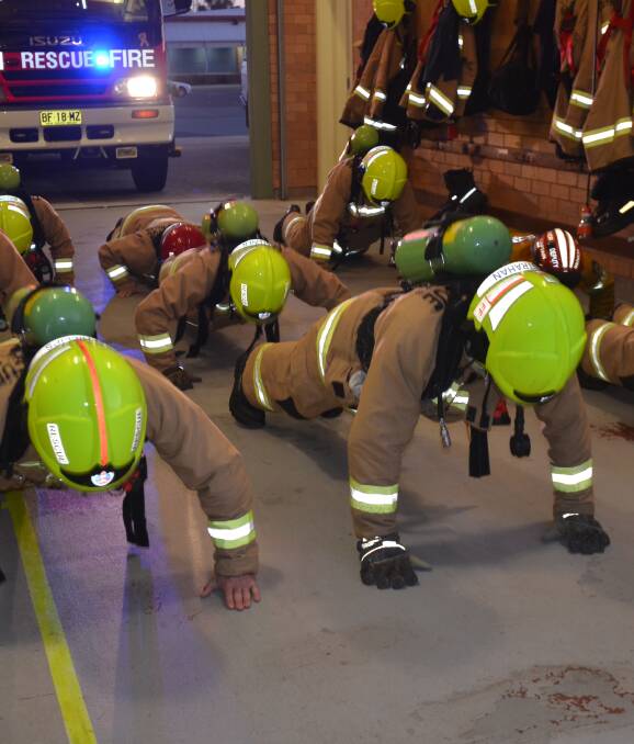 GRAVITY BUSTERS: Moruya Fire and Rescue and Moruya RFS firefighters push up for PTSD.
