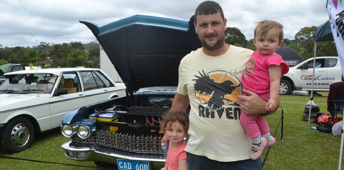 CADDY DADDY: Ryan, Molly and Annie Ward with a beautifully turned out Cadillac at the South Coast Nationals in Moruya at the weekend.