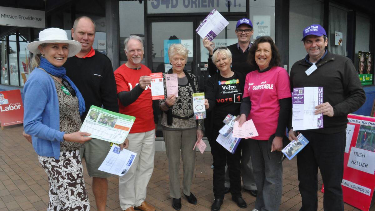 EARLY DAYS: Joslyn Van der Moolen (Greens), John Green (Better way for Batemans Bay), Steve Cressey (Labor), Bette Debney (A Chance for Change), Coral Anderson (Community Voice Eurobodalla), Lindsay Brown (Your Team, Your Future), Mandy Hall (A Chance for Change) and Peter McLaughlin (Your Team, Your Future) at the Batemans Bay pre-poll centre.