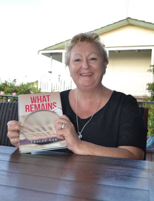 MUCH REMAINS: Malua Bay author Tracey Lee with her novel What Remains, the first in a four book series set largely around the Eurobodalla.