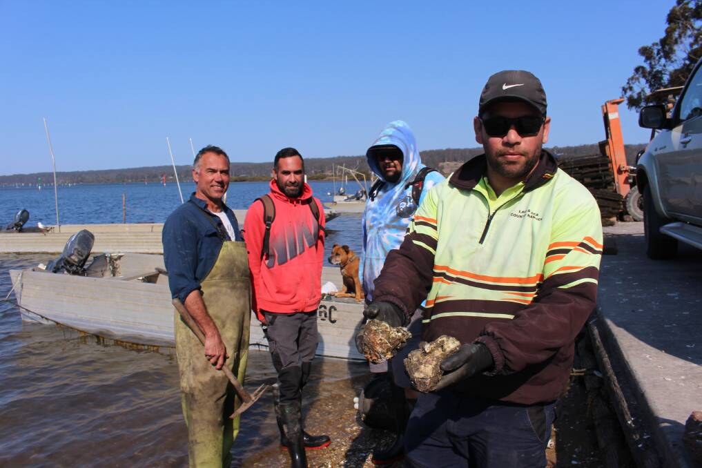 Smashing team: Last year a Pacific oyster three times this size was found weighing over 1.5kg - which would produce millions of spat (baby oysters) after spawning. Peter Ferguson, James Cruse, Ethan Cruse and Allan Aldridge.
