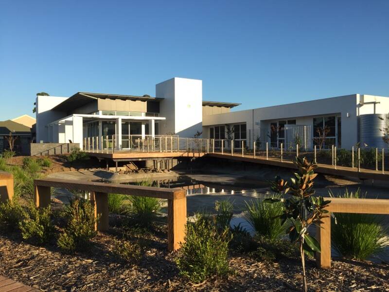FRESH LOOK: The newly completed Banksia Lodge Broulee extension featuring a tranquil pond and decking is the perfect place for a mindful stroll.