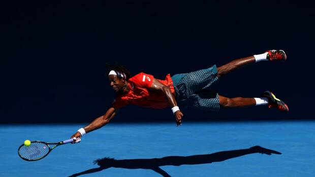 Gael Monfils of France dives for a forehand. Photo: Cameron Spencer

