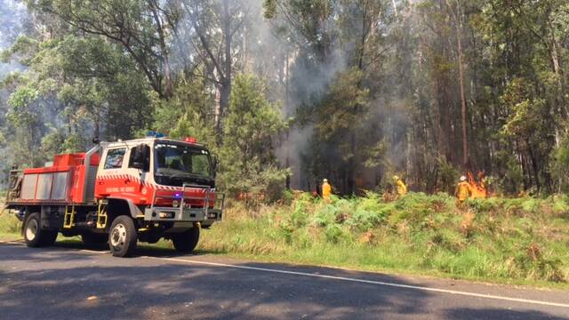 Broulee RFS fighting the fire. Picture: Stan Gorton. 
