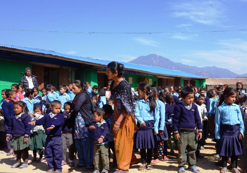 NEW CLASSROOMS: Students at a school north, east of Kathmandu, where the Asha Foundation will build four new earthquake-proof classrooms. 