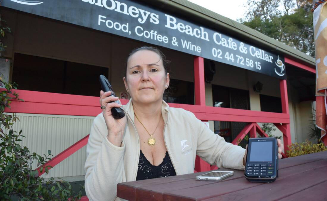NOT HAPPY: Sylvie Siteaud is not happy with Telstra after she lost phone and internet connection last week, affecting her Maloneys Beach business. 