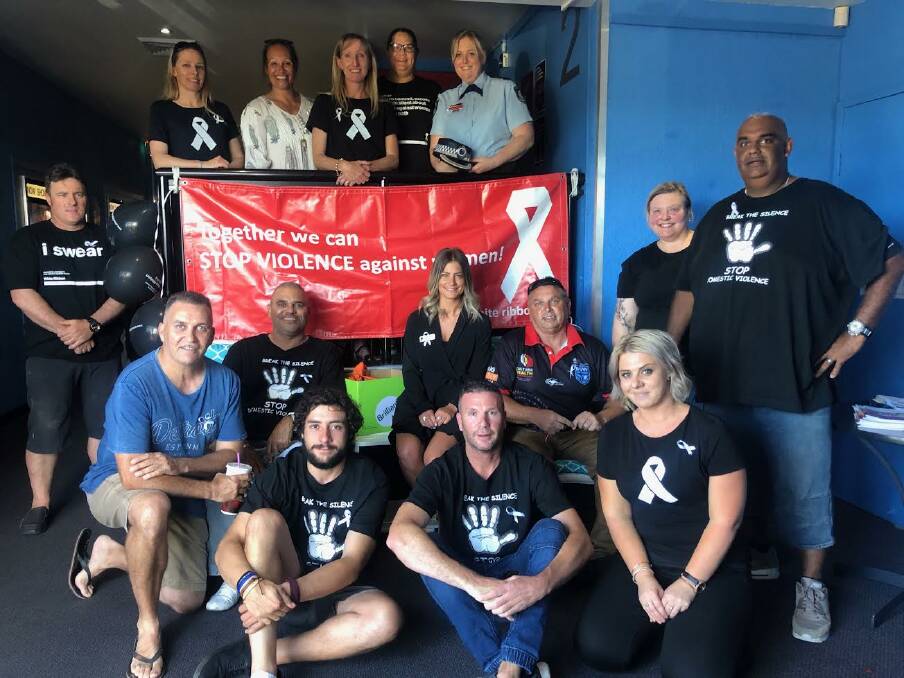 NO TO VIOLENCE: South Coast Police District Inspector Angela Burnell, Domestic Violence Liaison Officer Senior Constable Jo Flood and others spread the White Ribbon message in Batemans Bay last week.