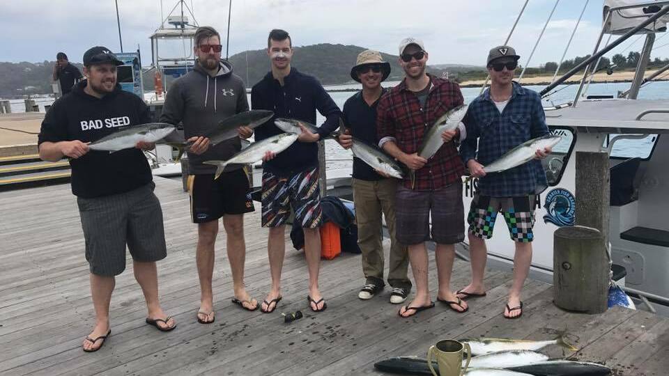 KING CATCH: These boys had a good trip on Narooma charter boat Playstation on Saturday getting some just legal kingfish with skipper Nick Cowley. 