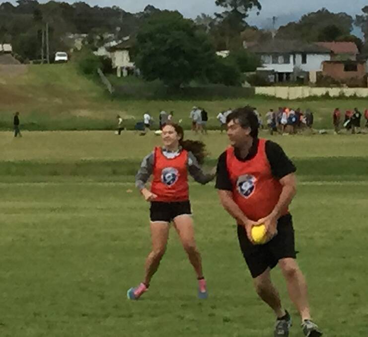 Andrew Passlow finds AFL 9’s is the Elixir of Youth as he shows his moves, with Aymee Wise in support. Photo: Contributed 