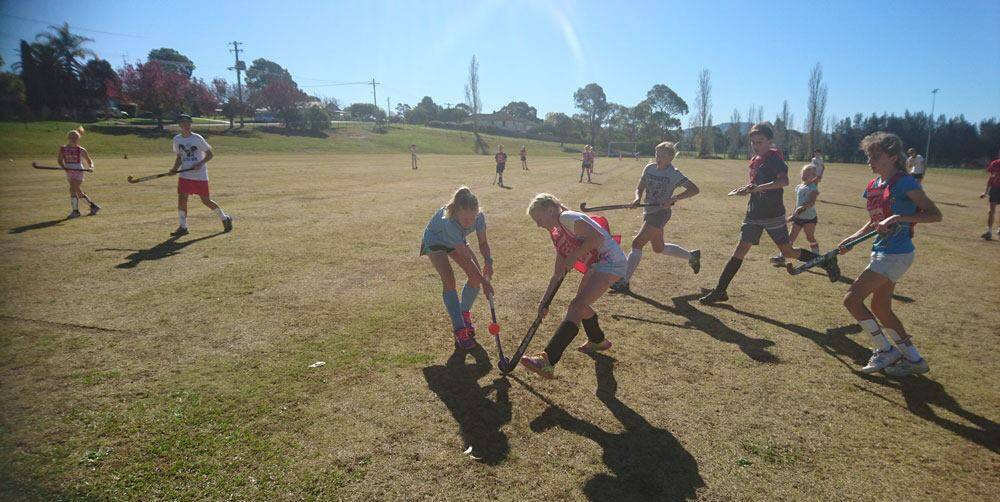 STICKING TOGETHER: A recent game from the Eurobodalla Hockey Association.File Picture. Draw for Saturday: 11am Minkey, 11.45am Juniors, 1.30pm Knights v Wanderers, 3pm CBK v Strikers. 