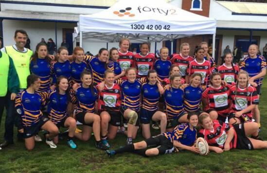 GIRL POWER: The Batemans Bay Boars female team with members of the empower rugby program in Canberra. The two sides played a game in Canberra on Saturday.