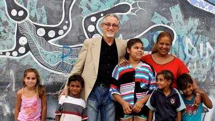 Pen power: Cuban ambassador Pedro Monzon and Cuban teacher Lucy Nunez with Aboriginal children in Bourke. Photo: Edwina Pickles