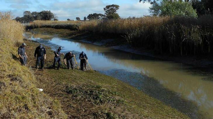 The search continues: police scour the 8 Mile irrigation channel for evidence Photo: NSW Police