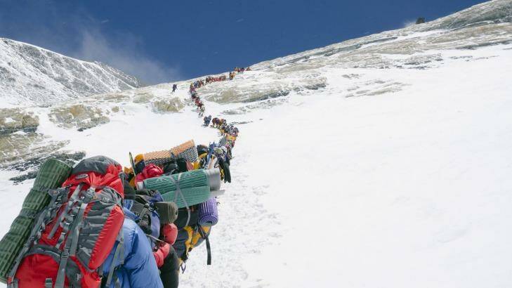 A line of climbers on the Lhotse Face, Mount Everest. Photo: Christian Kober