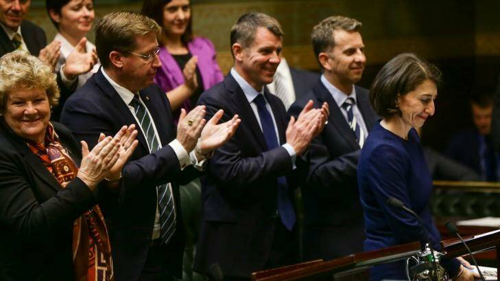 NSW Premier Mike Baird and the front bench applaud at the conclusion of Treasurer Gladys Berejiklian's budget speech at State Parlaiment. Photo: Dallas Kilponen