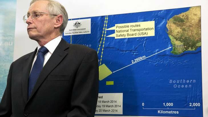 John Young of the Australian Maritime Safety Authority in front of a diagram showing the search area for Malaysia Airlines Flight MH370 in the southern Indian Ocean. Photo: Reuters