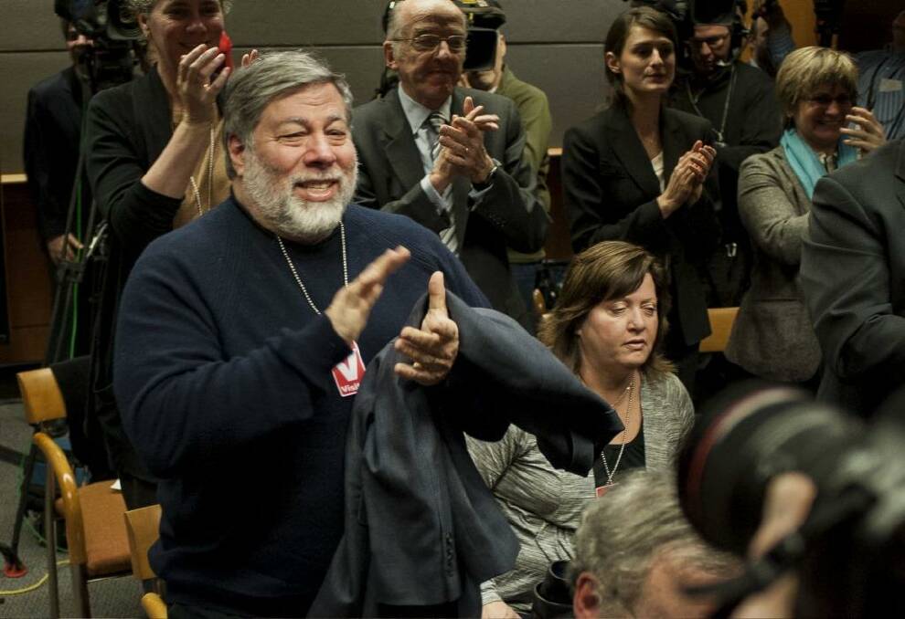 Steve Wozniak, co-founder of Apple Inc., applauds during the meeting to vote on internet regulations at the Federal Communications Commission (FCC) headquarters in Washington.  Photo: Pete Marovich