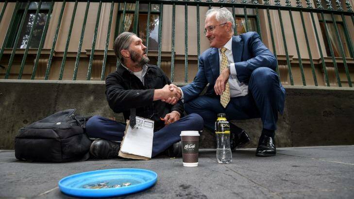 Feeling the love: Prime Minister Malcolm Turnbull with homeless man Kent Kerswell. Photo: Justin McManus