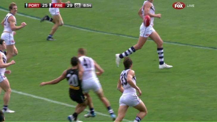 Fremantle's Paul Duffield makes high contact to Port Adelaide's Chad Wingard. Photo: Fox Footy