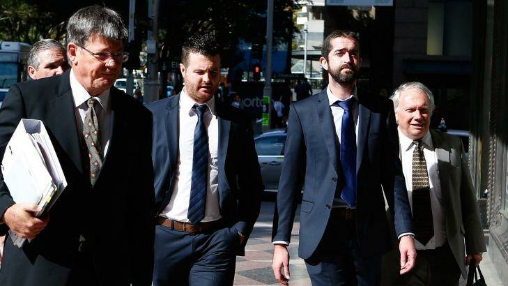 Barry Lyttle (centre) arrives at court with his lawyer Chris Watson (left) and brother Patrick (right).
 Photo: Daniel Munoz
