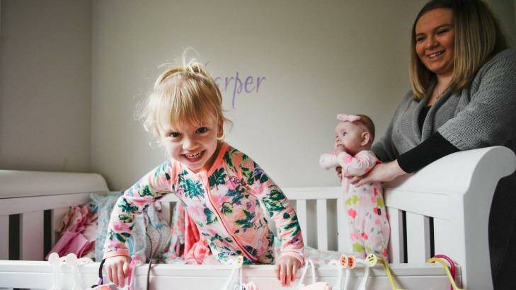 Ashley Cullens and her daughters Ava (3) and Harper (six months) at home in Glenmore Park in Sydney. Photo: Fiona Morris