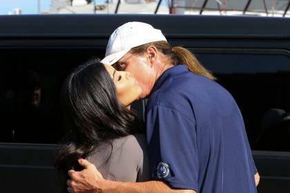 Embracing change: Kim Kardashian and her step father Bruce Jenner. Photo: Bauer-Griffin