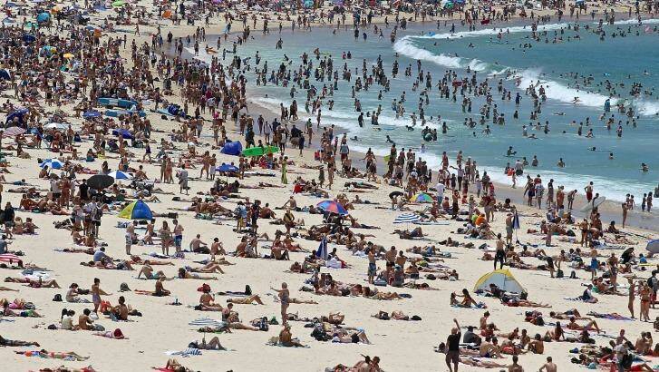 Sunny change: Hot holiday weather brought the masses to Bondi Beach on Monday. Photo: Ben Rushton