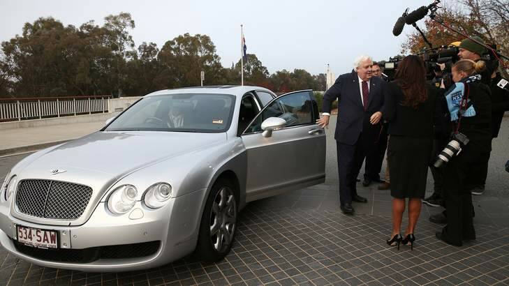 Space hog: Clive Palmer alights from his Mercedes. Photo: Alex Ellinghausen