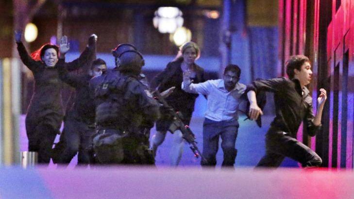 Five hostages escape from the Lindt cafe in Sydney's Martin Place during the siege in December 2014.  Photo: Andrew Meares