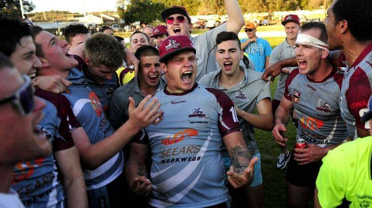 Queanbeyan Kangaroos players and supporters sing their old club song after winning the 2013 Canberra Raiders Cup grand final. Photo: Melissa Adams