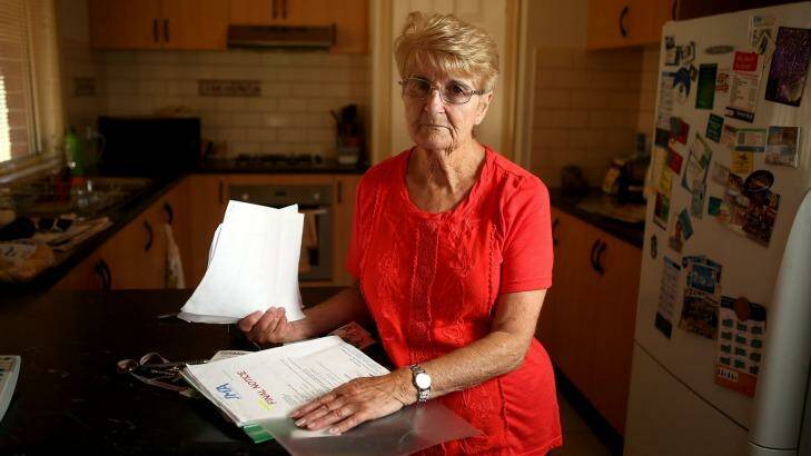 Elaine Gray, 75, with the final notice she received from Spotless' debt collectors for a bill that she had already paid. Photo: Pat Scala