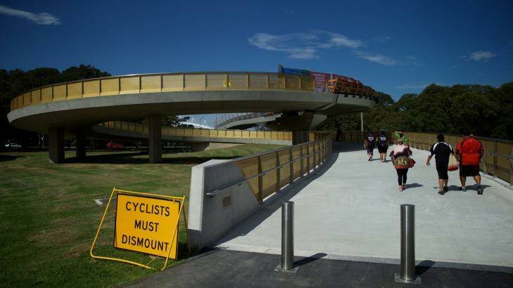 Not impressed: Cricket fans trudge around the Albert "Tibby" Cotter Bridge heading to the SCG. Photo: Wolter Peeters