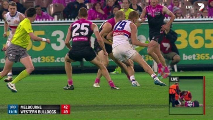 Western Bulldogs' Liam Jones makes high contact to Melbourne's Dean Terlich. Photo: Channel Seven