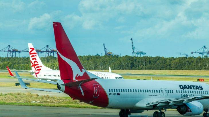 Qantas claims airports resort to monopolistic tactics in negotiations with airlines over charges. Photo: Glenn Hunt