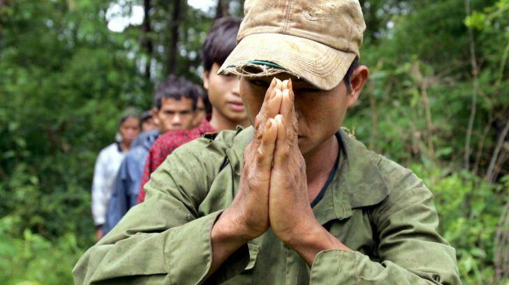 A Montagnard hill tribesman asylum seeker prays after emerging from dense forest in Cambodia's north-eastern province of Ratanakiri in 2004. Photo: Adrees Latif