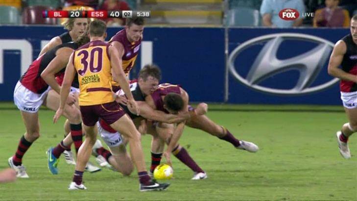 Brisbane's Andrew Raines makes high contact to Essendon's Brendon Goddard. Photo: Fox Footy