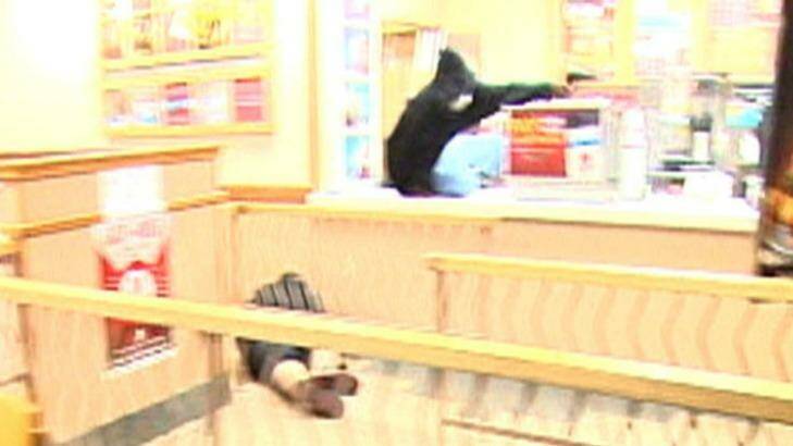 A still from a video released by the Omaha Police Department showing the armed robber shooting at police. Photo: Supplied