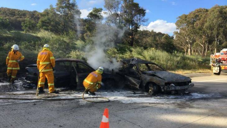 Burnt out: police say one car crashed into another parked on the side of the road. Photo: Fleta Page