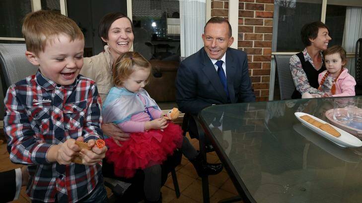 Prime Minister Tony Abbott meets with Skye Mendl (left) and her children Austin and Evelyn, and Vanessa Burdett (right) and her daughter Stella on Monday. Photo: Alex Ellinghausen