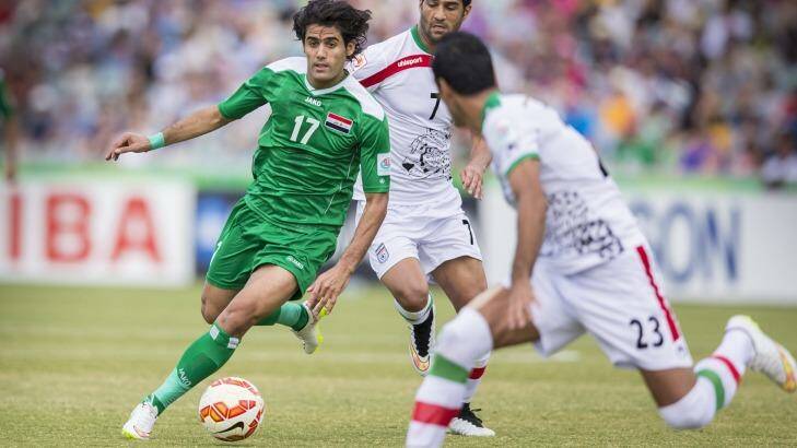 Free to play: Alaa Abdulzehra on the ball against Iran. A complaint about his appearance in the Asian Cup has been dismissed.  Photo: Matt Bedford