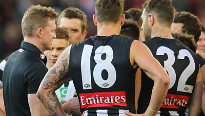 Nathan Buckley addresses his players